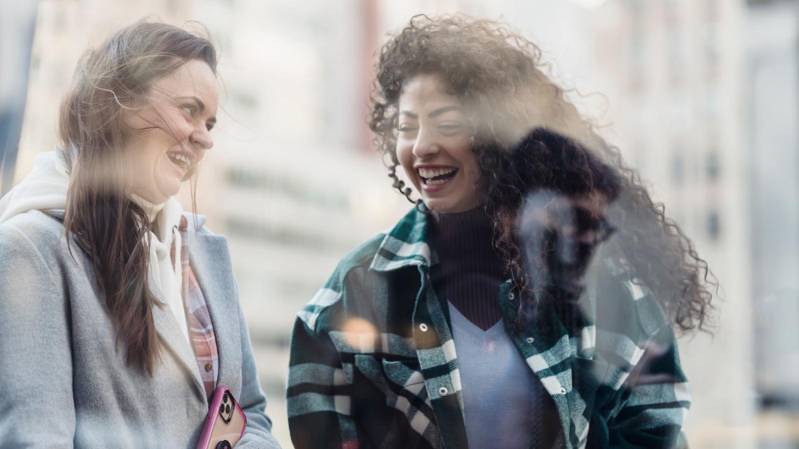 The Loyalty Trap: Why a Womans Decision to Stay Out of the Drama Backfired and Destroyed Her Best Friendship. Two women gossiping about another woman