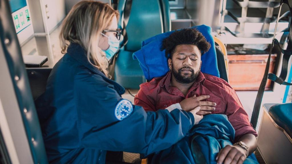 Man being checked out by an ER nurse