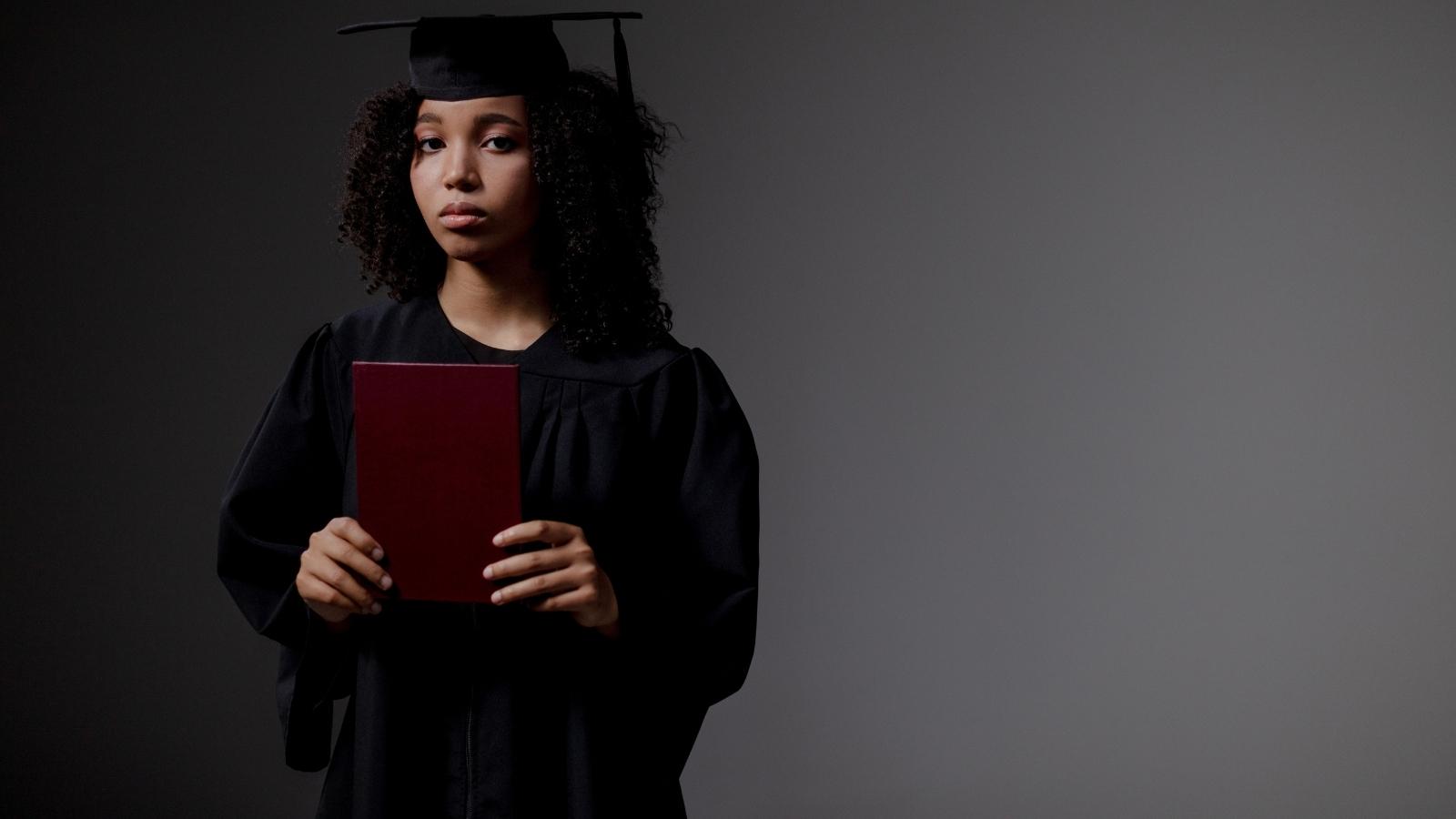 The Step Parent Trap: Why a Furious Graduate Quietly Re Wrote the Official Ceremony Program Behind Her Mothers Back Sad woman holding a graduation diploma