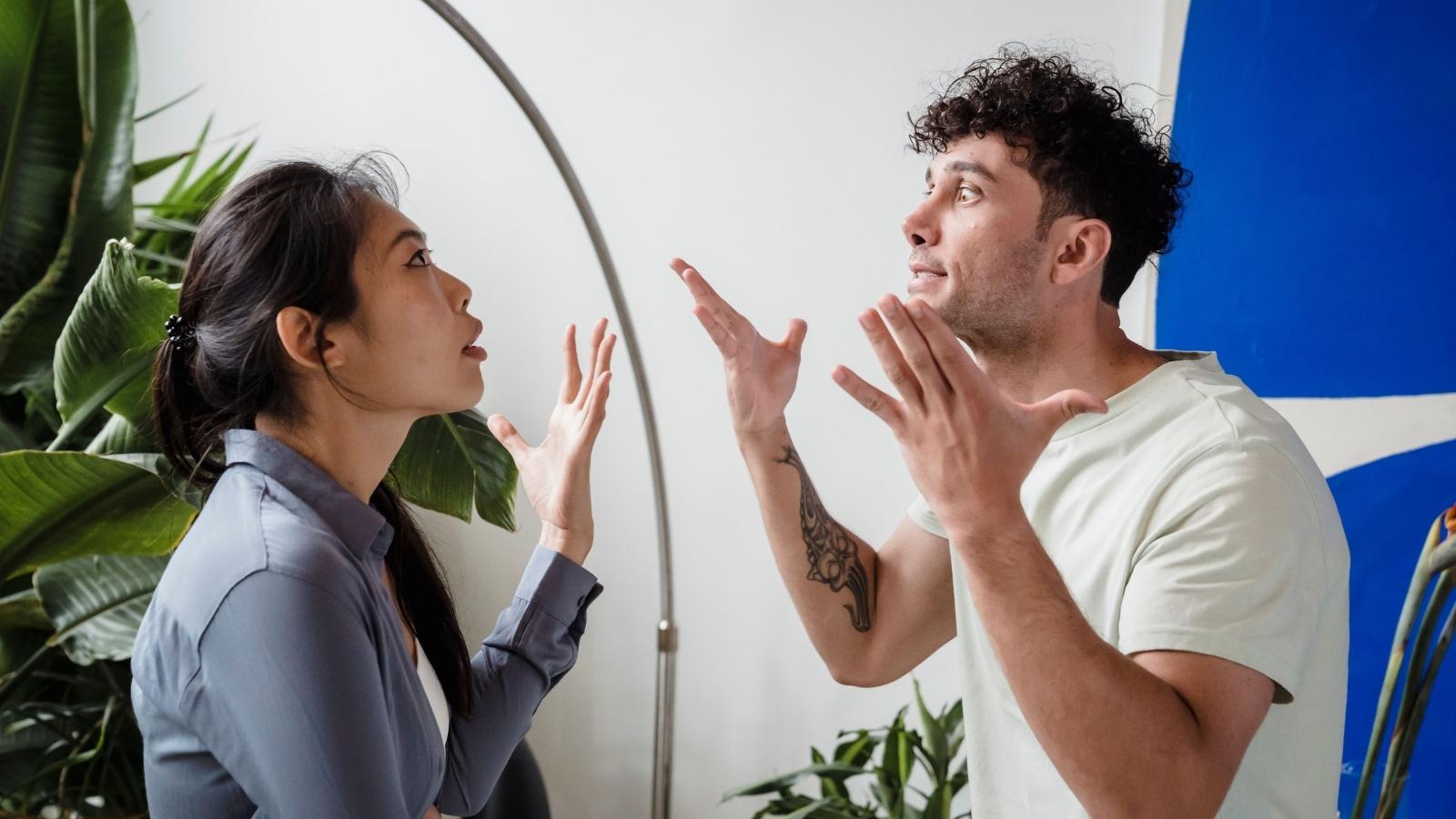 Husband and wife arguing over hosting family