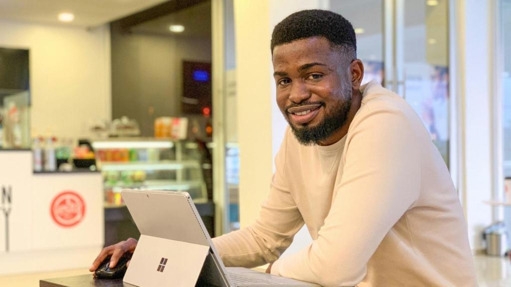 Young black man working a retail job