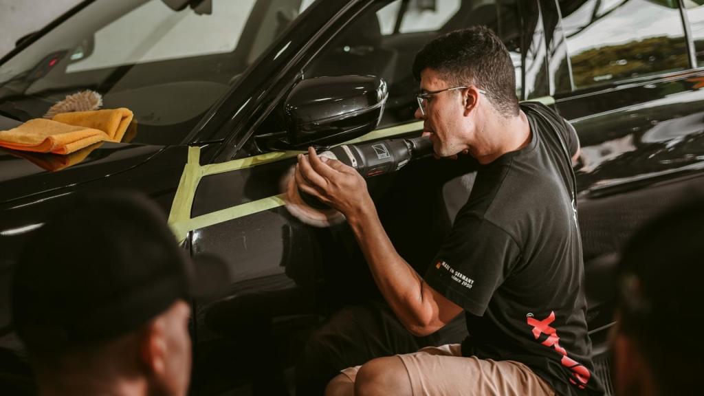 Man prepping a car for paint