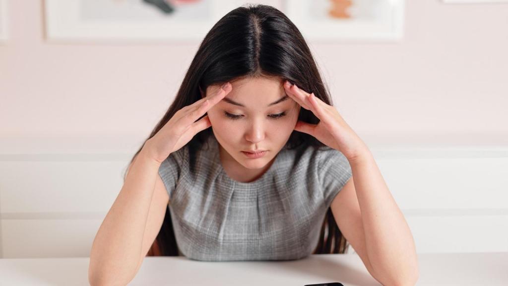 Woman stressed and thinking if to call or not