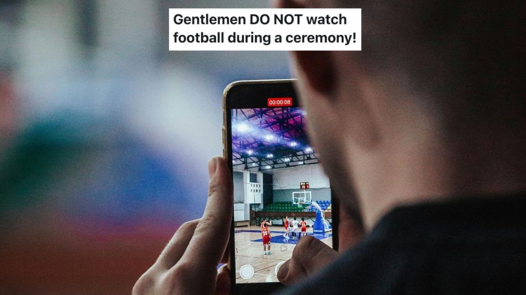 man watching sports on a phone
