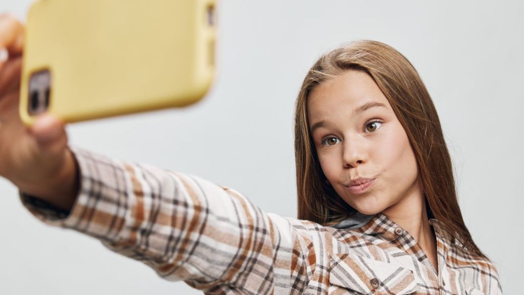 teenage girl taking a selfie