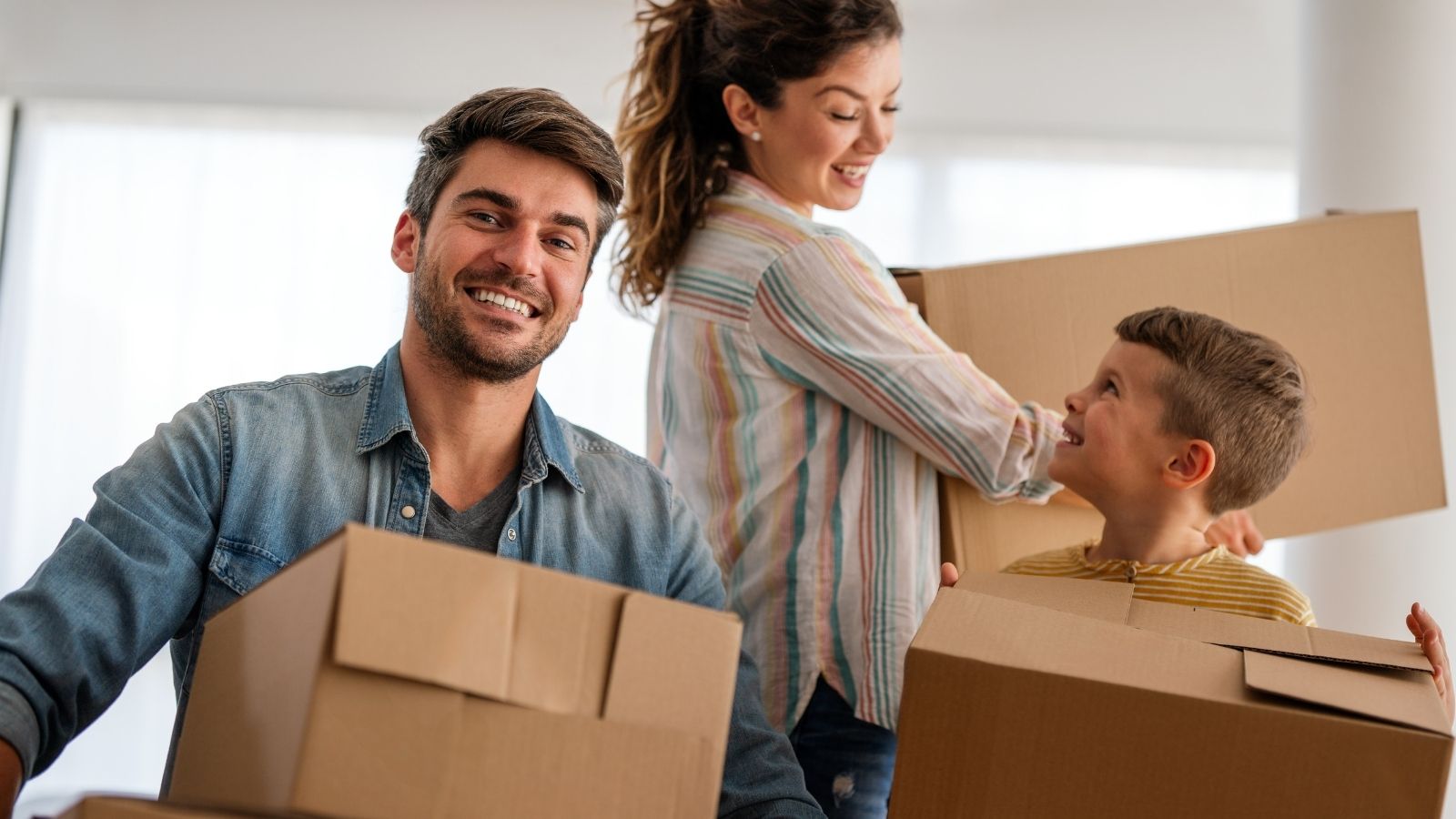 A Landlord Stole Their Security Deposit for Pet Damage. The Only Problem? They Never Owned a Dog, and the Law Was on Their Side. mom, dad and little boy carrying moving boxes