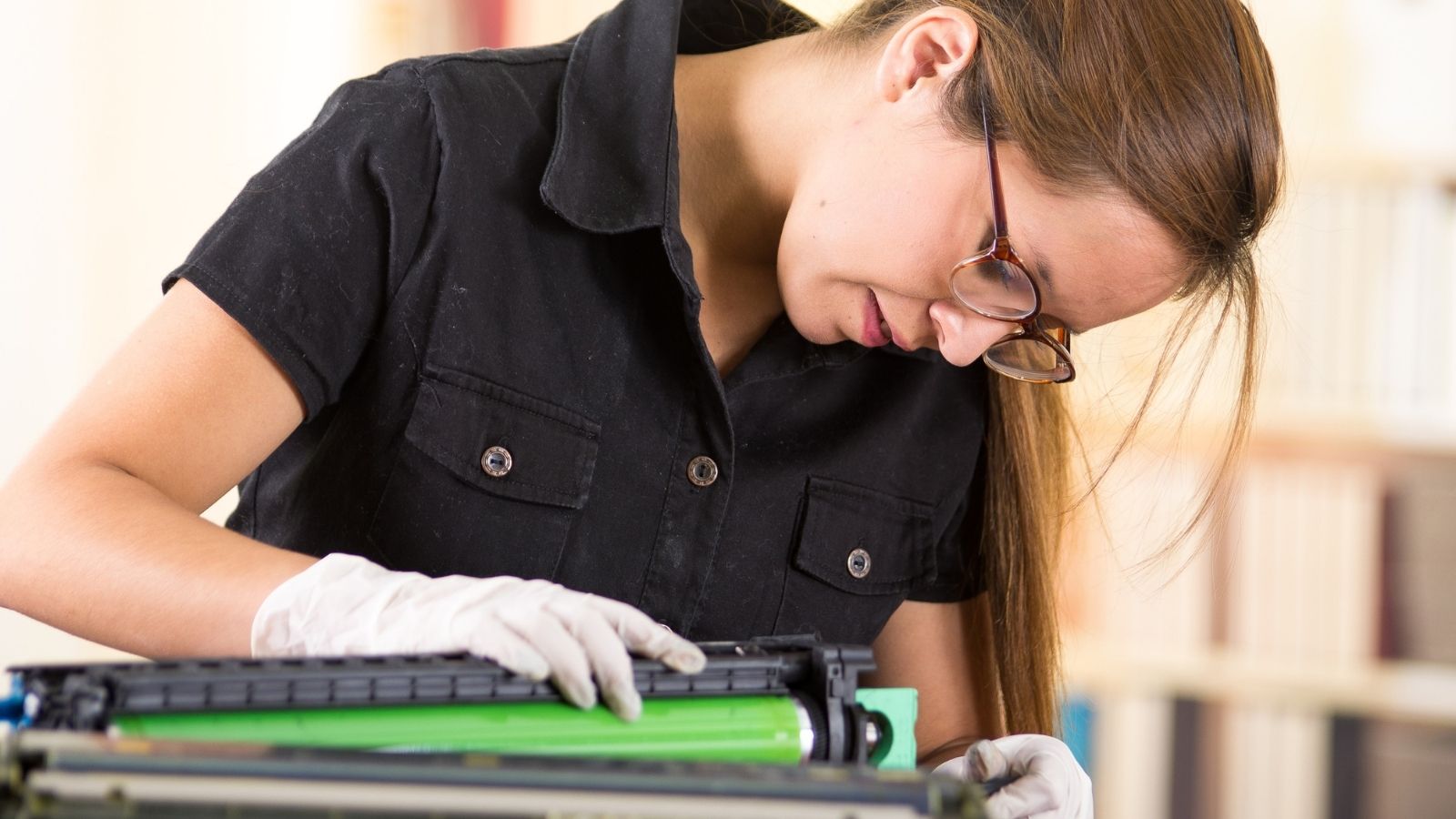 An IT Worker Faced a Worst Case Scenario Fixing a Campus Printer. The Condescending Academic Attitude That Made the Shift Unbearable. young woman repairing a printer
