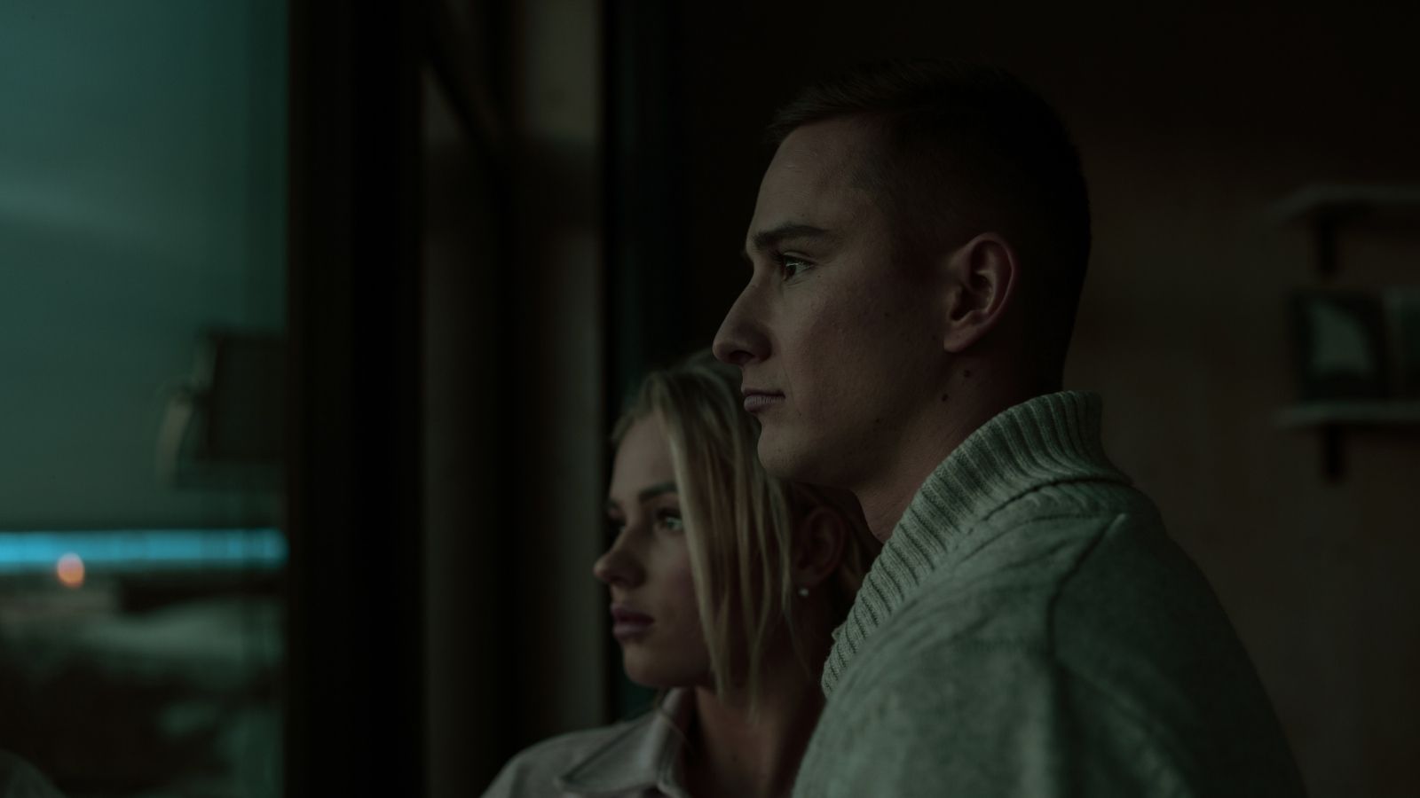 couple looking outside at night