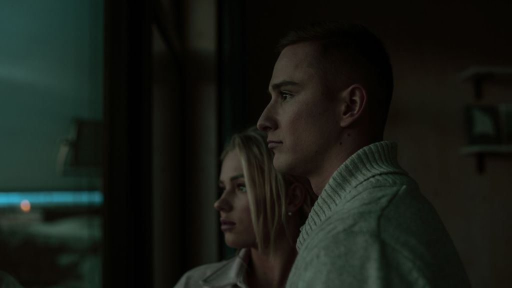 couple looking outside at night
