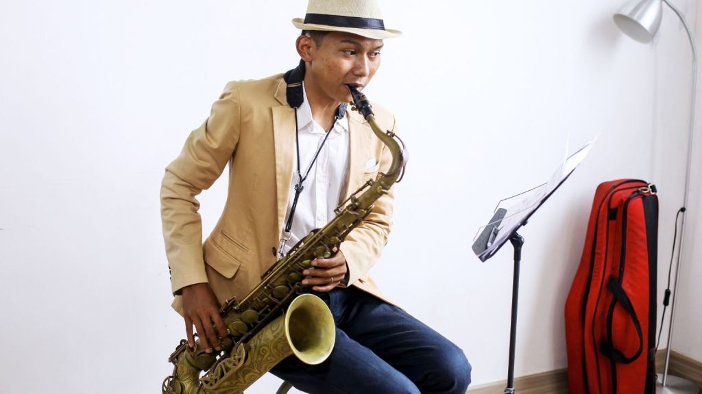 man playing a saxophone