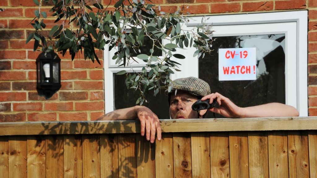 annoying man looking over his neighbor's fence