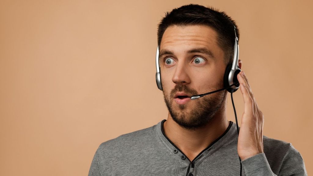 surprised man wearing a headset