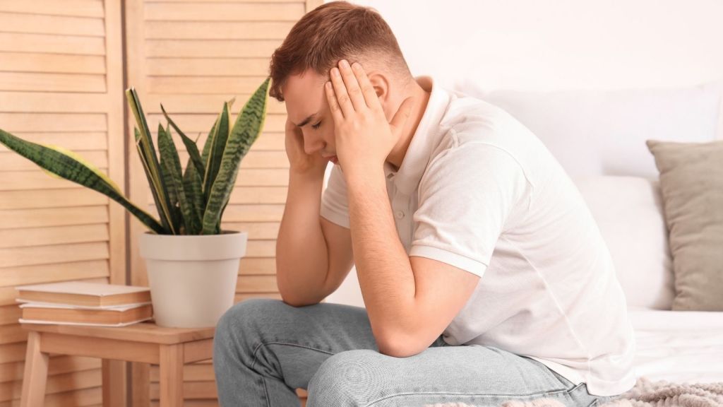 young man with a headache