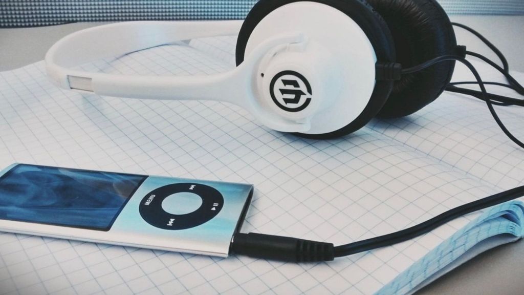 ipod nano connected to a pair of headphones
