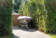 Her Neighbor’s Boat Has Been Stored in the Wrong Spot Long Enough — She’s Ready to Report Him to the City