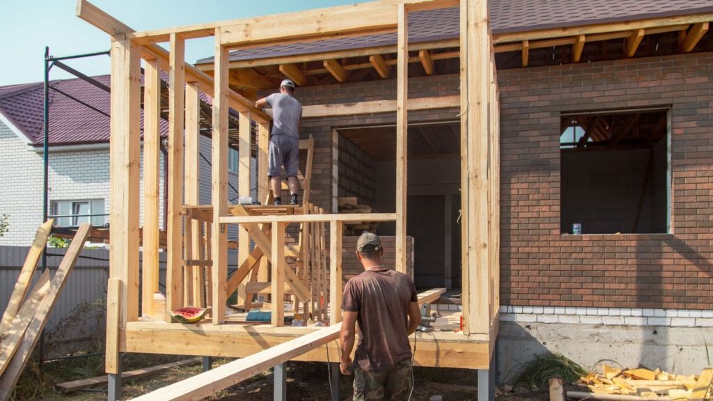 construction workers building a house