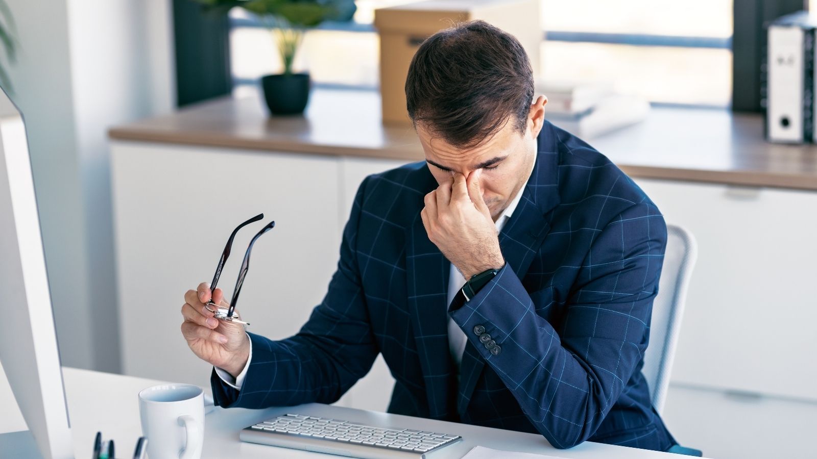 His Boss Wants Him to Supervise an Employee at Their Sister Company, But He Has Multiple Reasons He Doesnt Want To stressed out businessman thinking about what to do