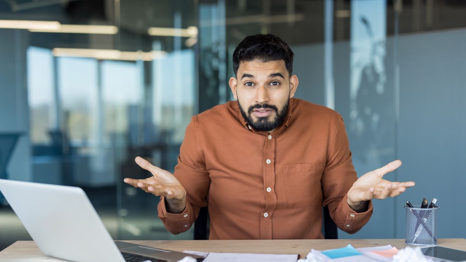They Worked the Extra Hours for the Money, But the Company Tried to Force a Vacation Policy on Them Instead office worker shrugging