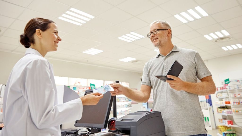 man paying with cash