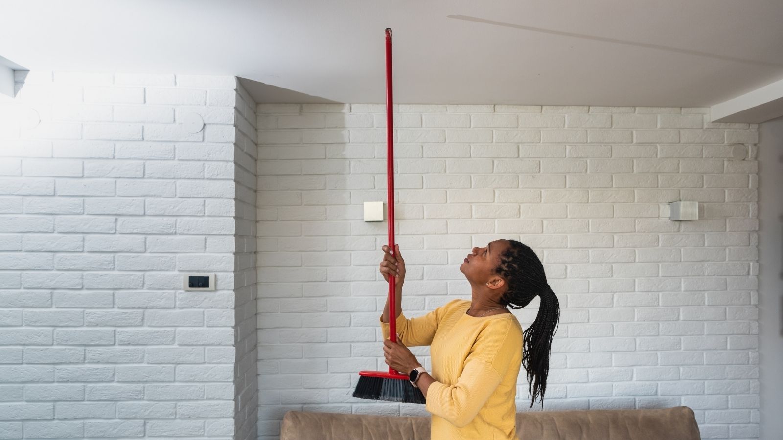 Their Downstairs Neighbor Complained About Noise and Said Walk Normal, So They Did, Which Was Exactly What Theyd Been Doing The Whole Time woman banging on ceiling with broom