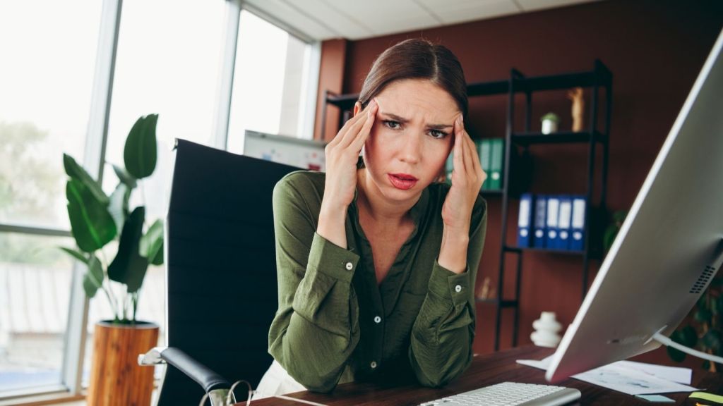 young businesswoman looking stressed out