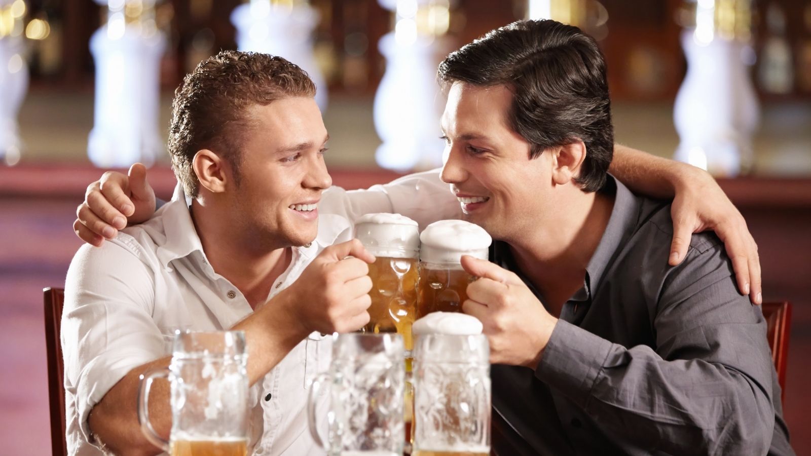She Thought She Was Just Helping a Customer. Minutes Later, She Realized She’d Just Exposed an Active Affair. two men with their arms around each other drinking beer