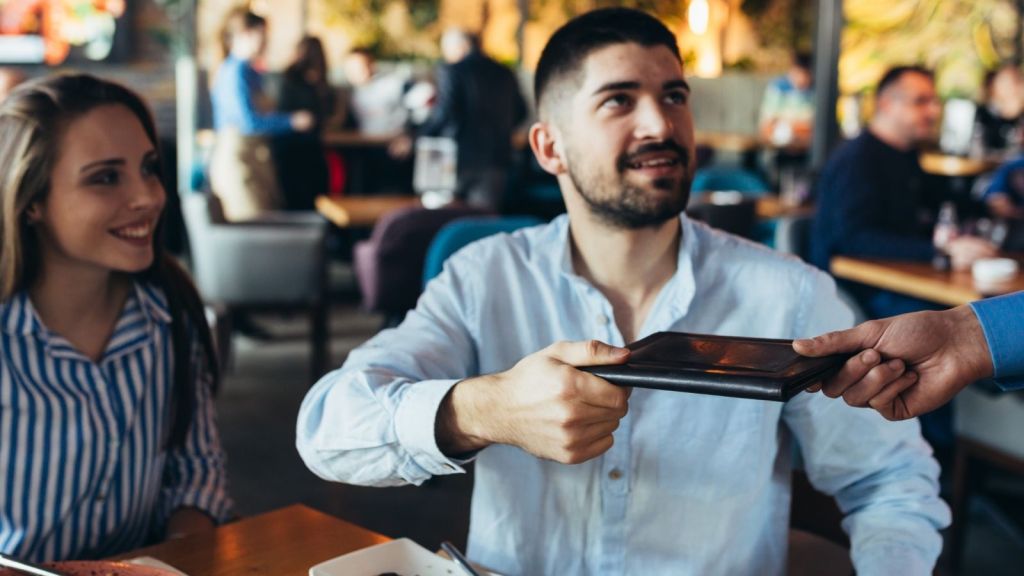 man paying restaurant bill