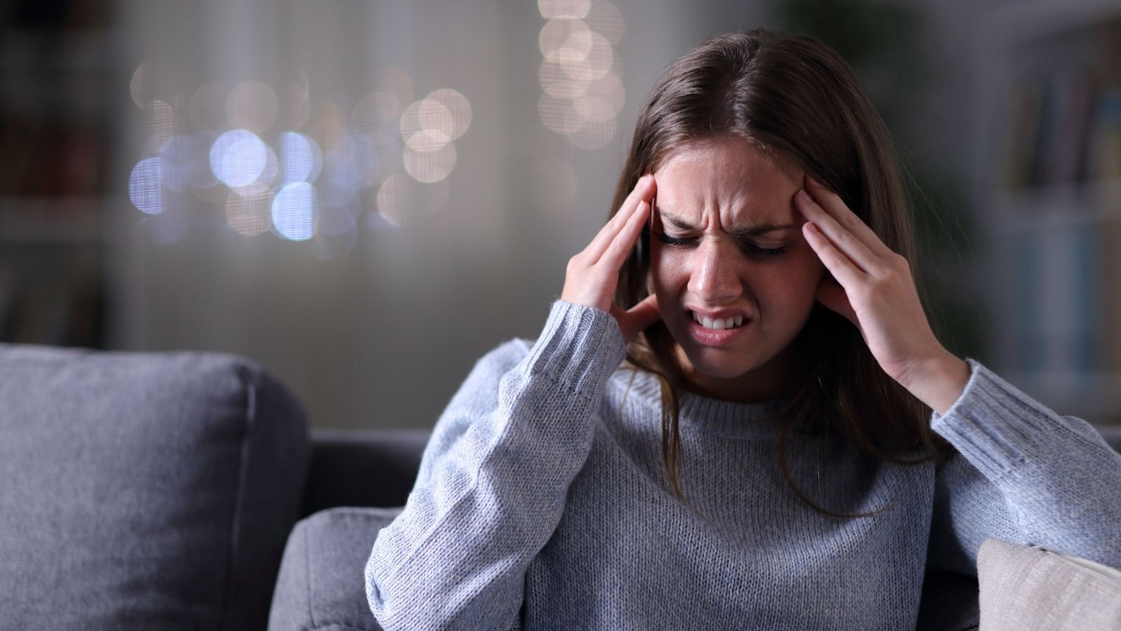 She Needed a Quiet Room for Her Migraine, but Her Boss Wouldnt Let Her Call Out Without a Negative COVID Result woman with migraine headache