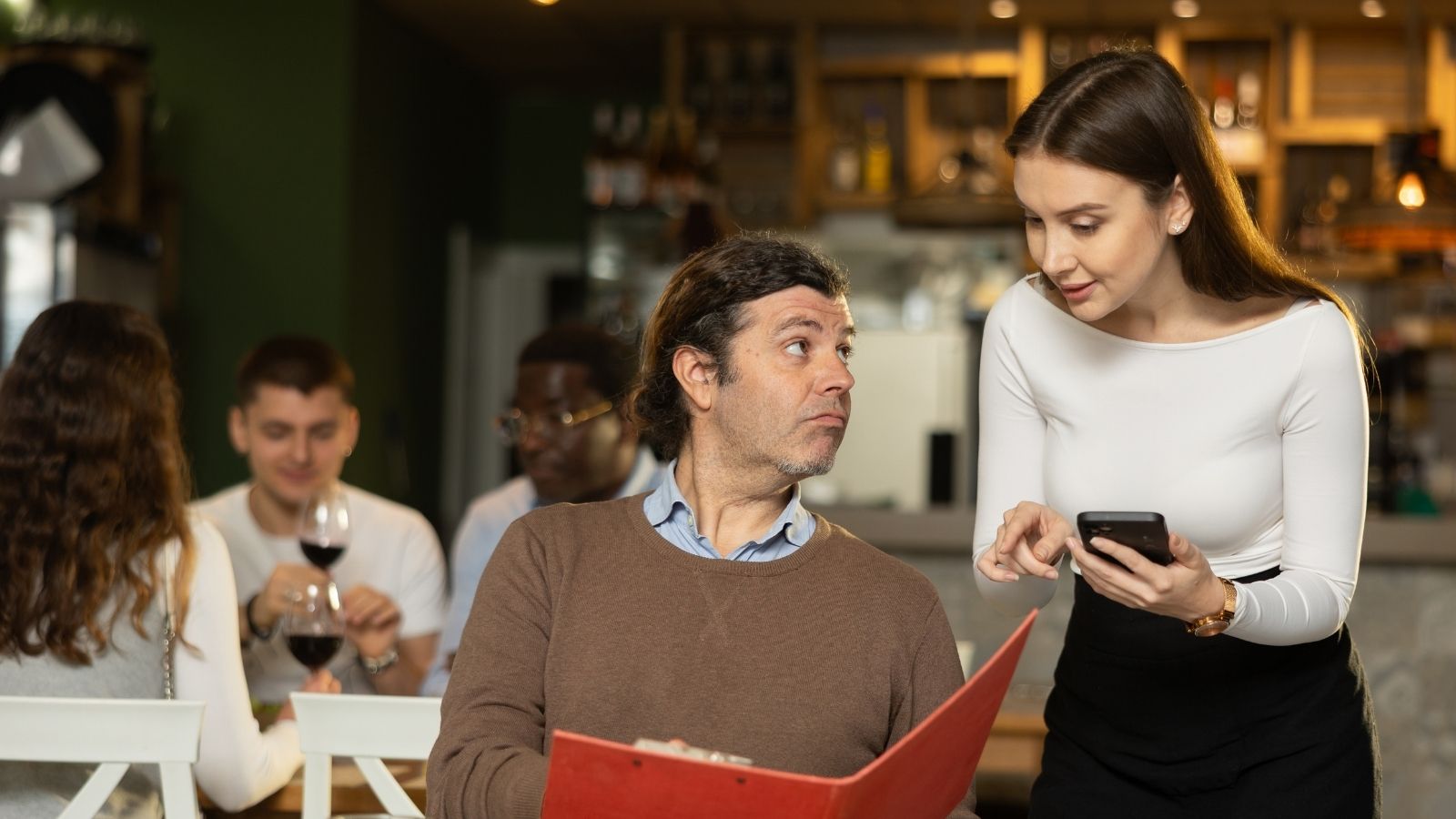 Family Seems Nice At First—Then Dad Accuses Waitress Of Lying About Their Past Visit waitress taking man's order