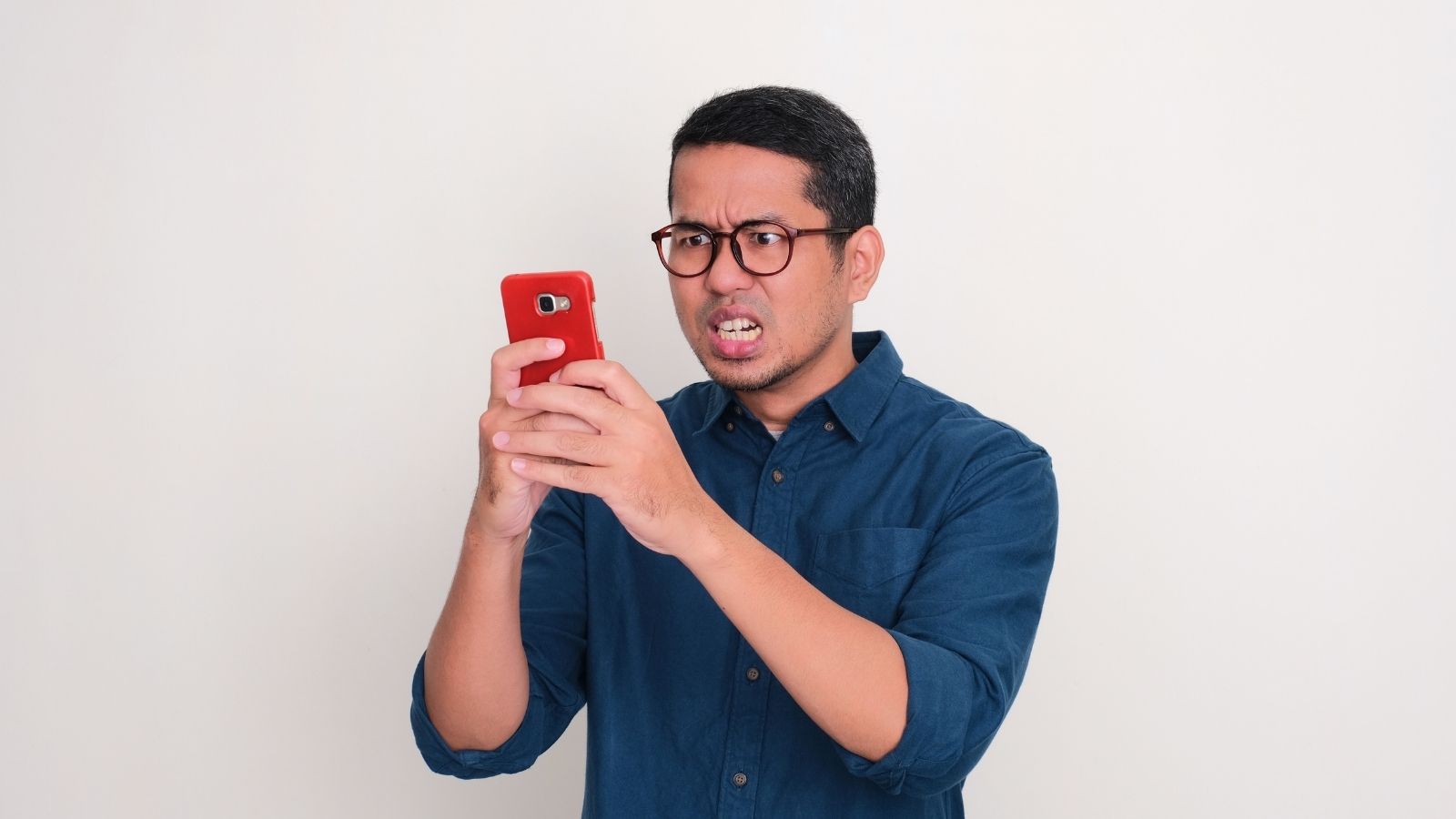 When Bad Neighbors Collide With Rising Rent, Leaving Isnt Always an Option: Why One Renter Refuses to Apologize for Staying Put angry man sending a text