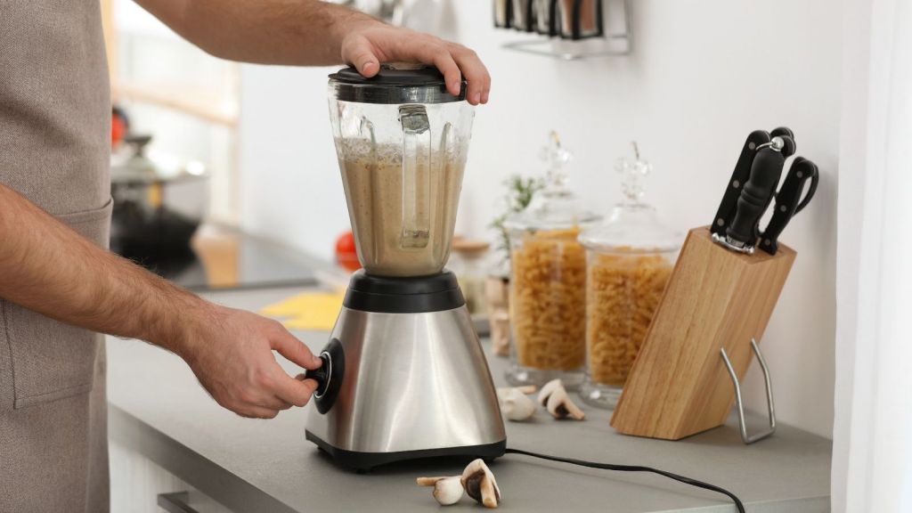 man using a blender