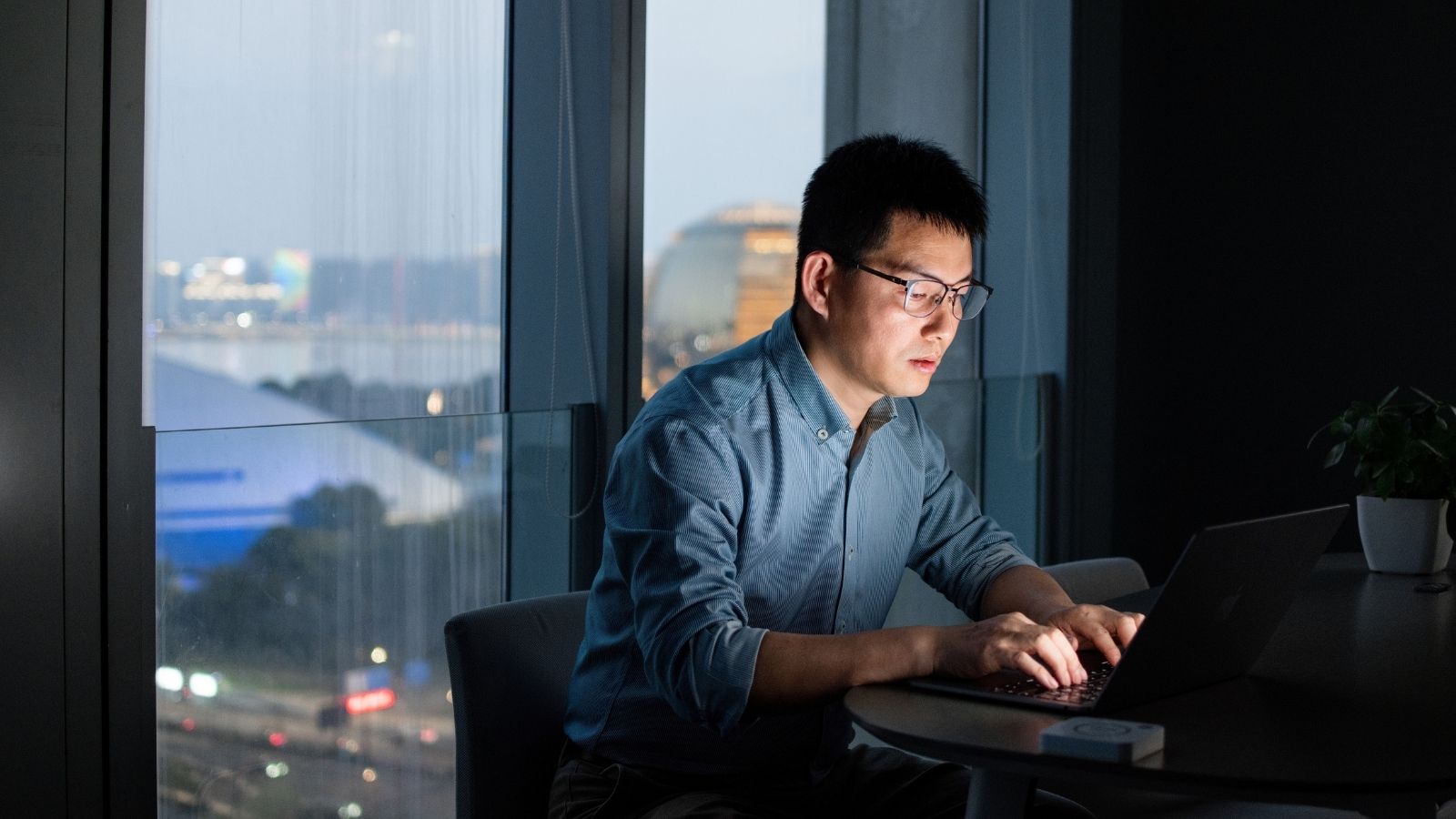 man working overtime in an office