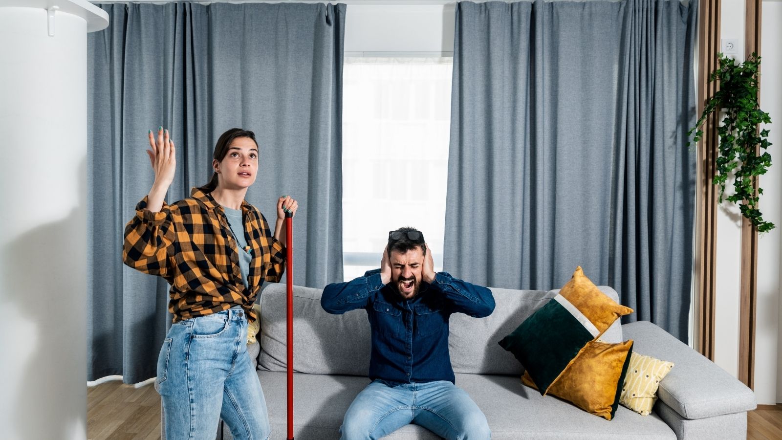 Her Upstairs Neighbor Lost His Job—Then His Behavior Took a Troubling Turn couple upset by noisy upstairs neighbor