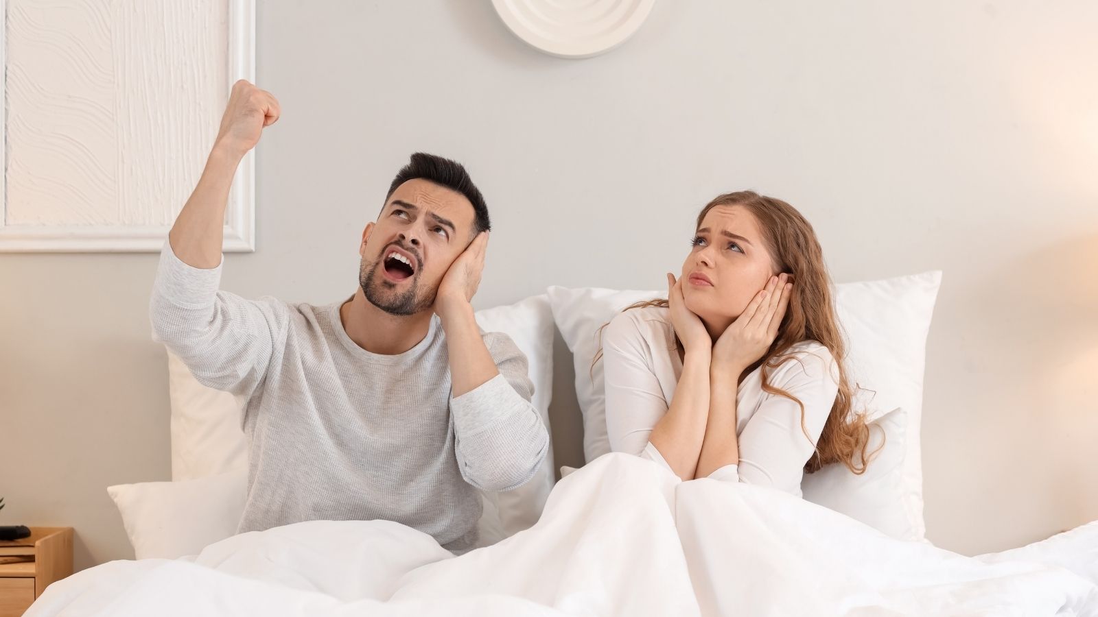 couple upset with noisy upstairs neighbor