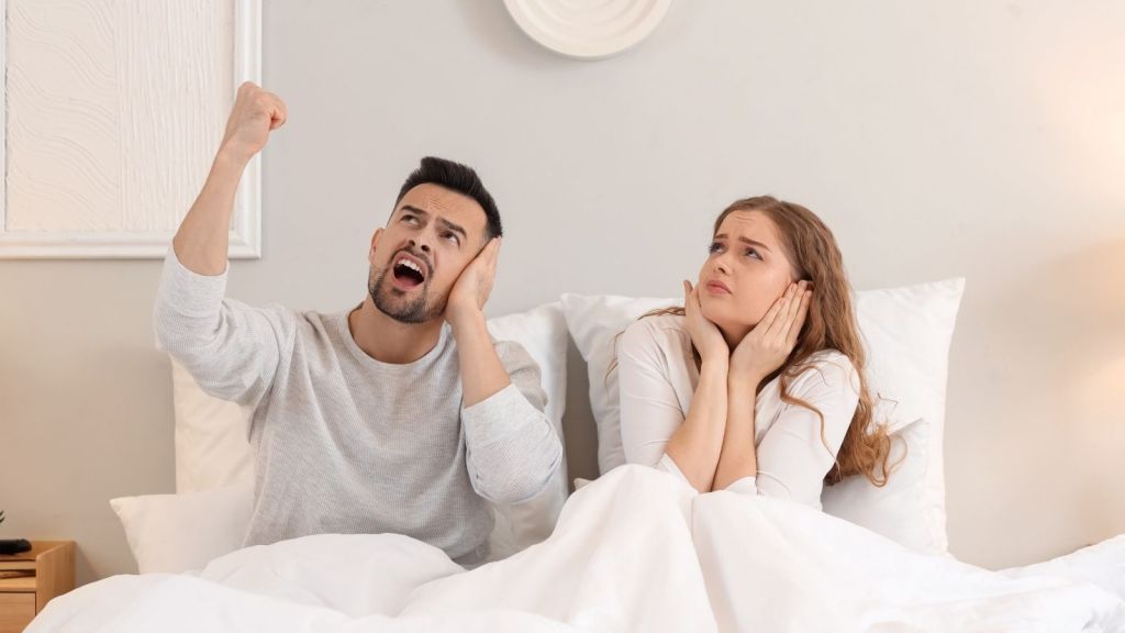 couple upset with noisy upstairs neighbor