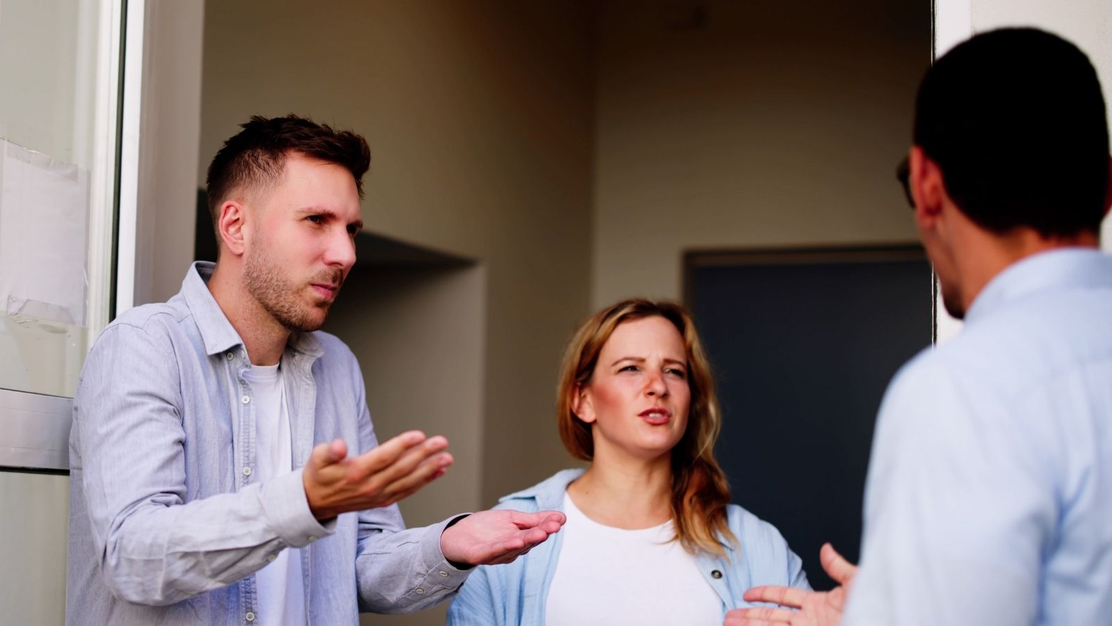 couple arguing with male neighbor