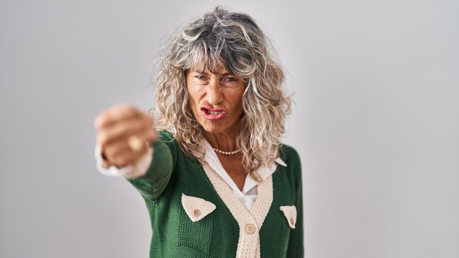 angry middle aged woman pointing