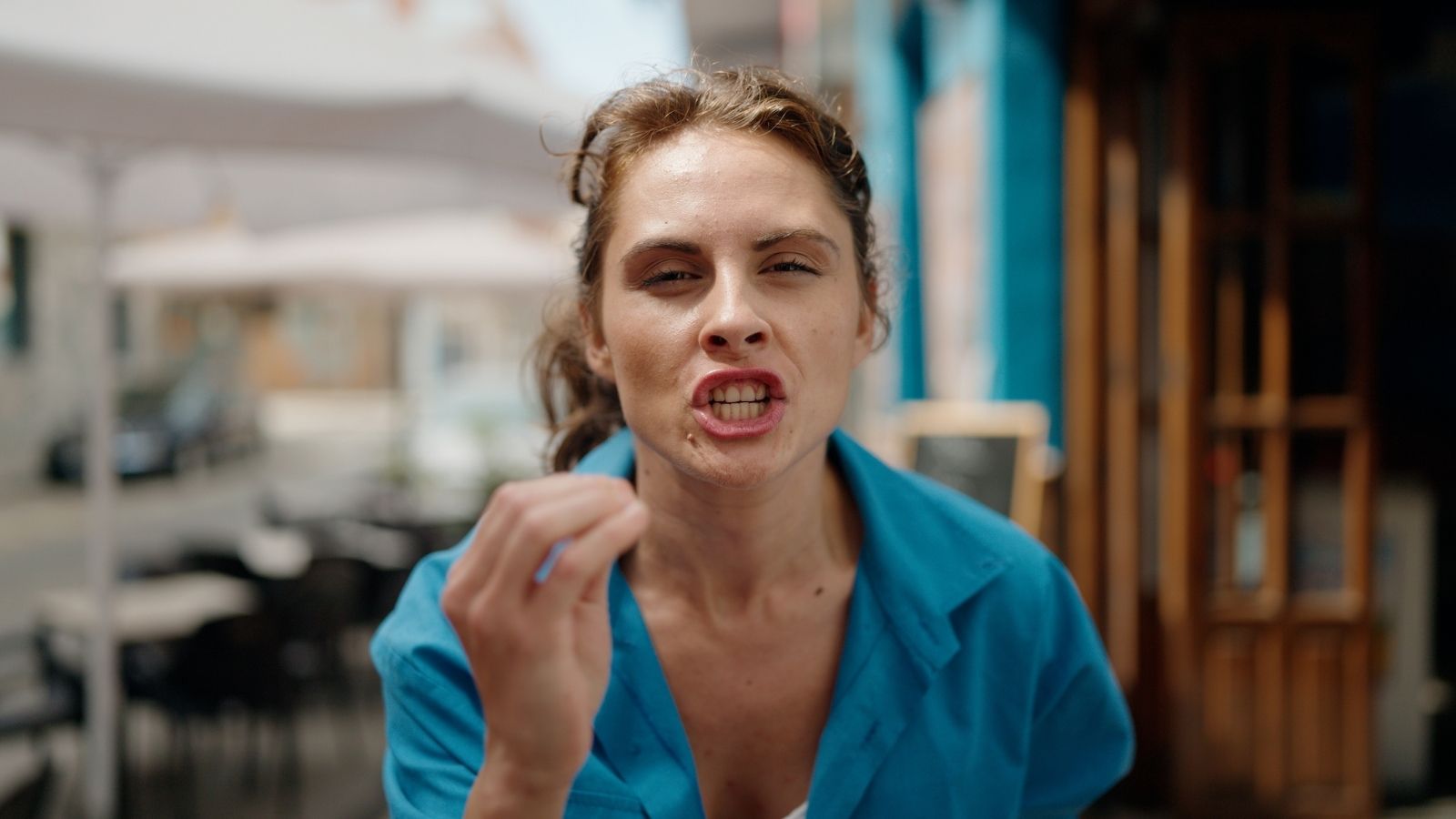 She Complained About The Restaurant Rules—But It Didn’t Stop Her Husband From Getting A Ticket angry woman outside restaurant