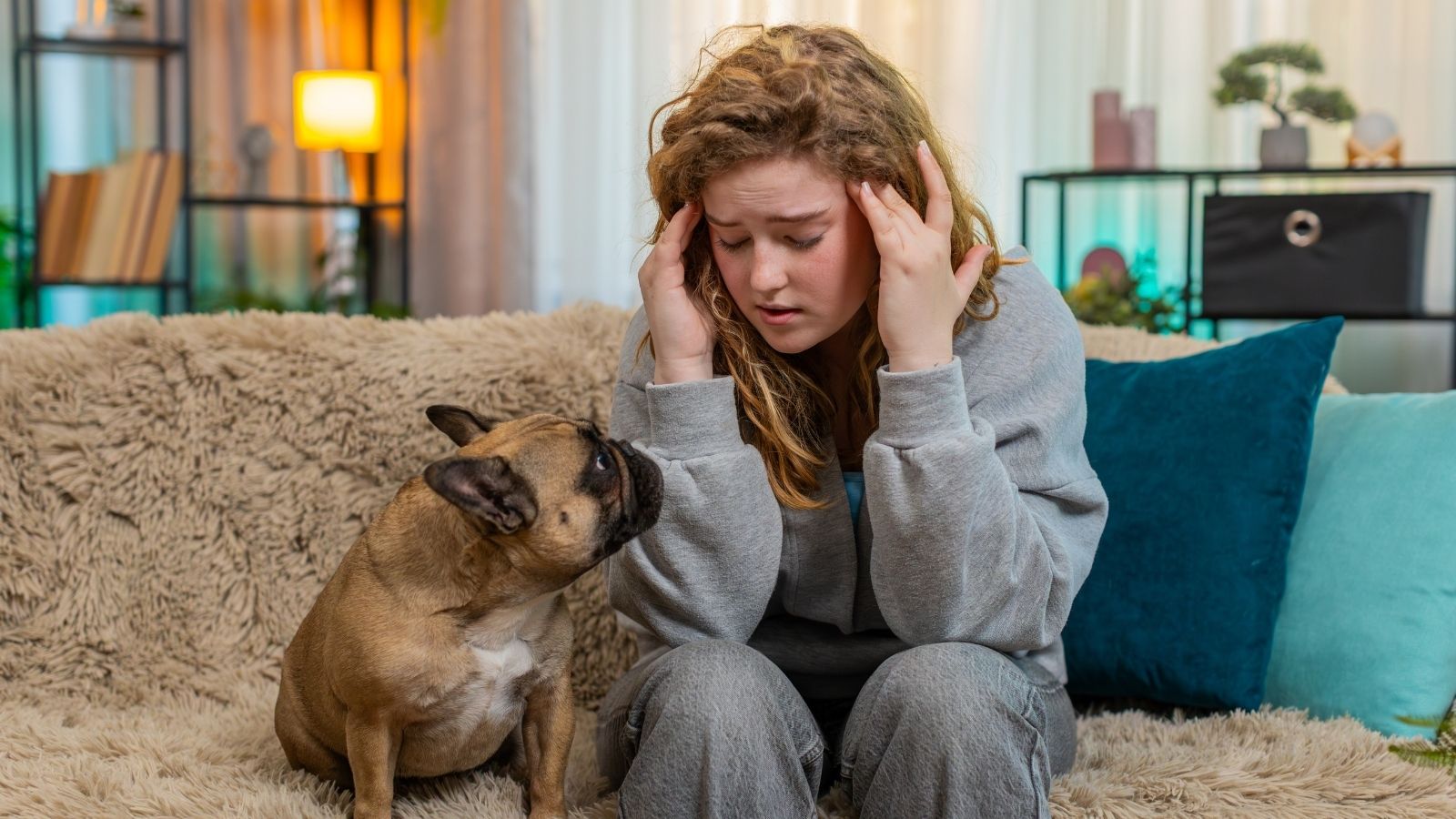 It Kept Me Up at Night: Young Woman Stressed Over Elderly Neighbors Odd Habits young stressed out woman sitting next to her dog