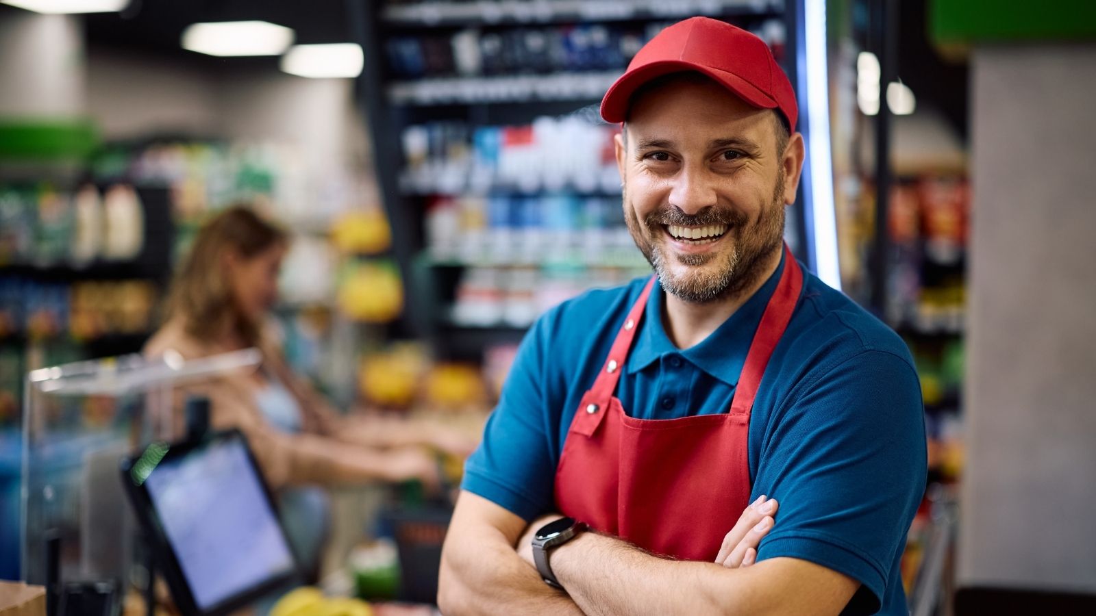 smiling cashier at a grocery store