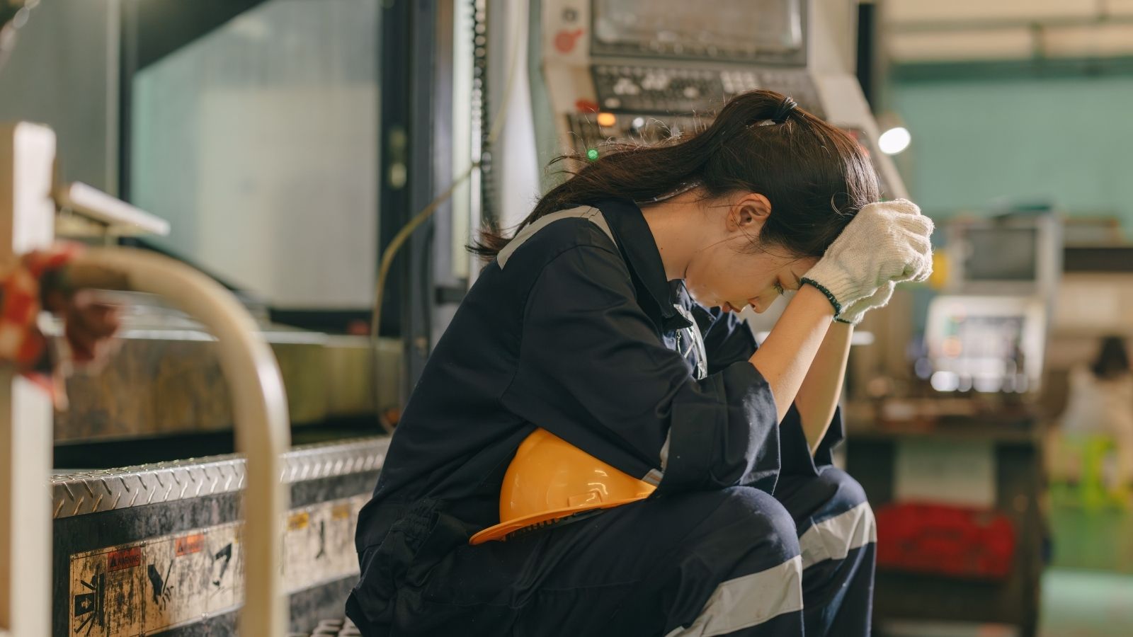 Supervisors Inappropriate Comments Make Her Uncomfortable—Now Shes Considering Going To HR upset female factory worker