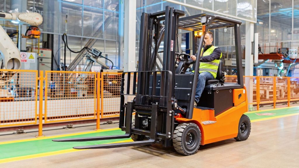 man driving a forklift