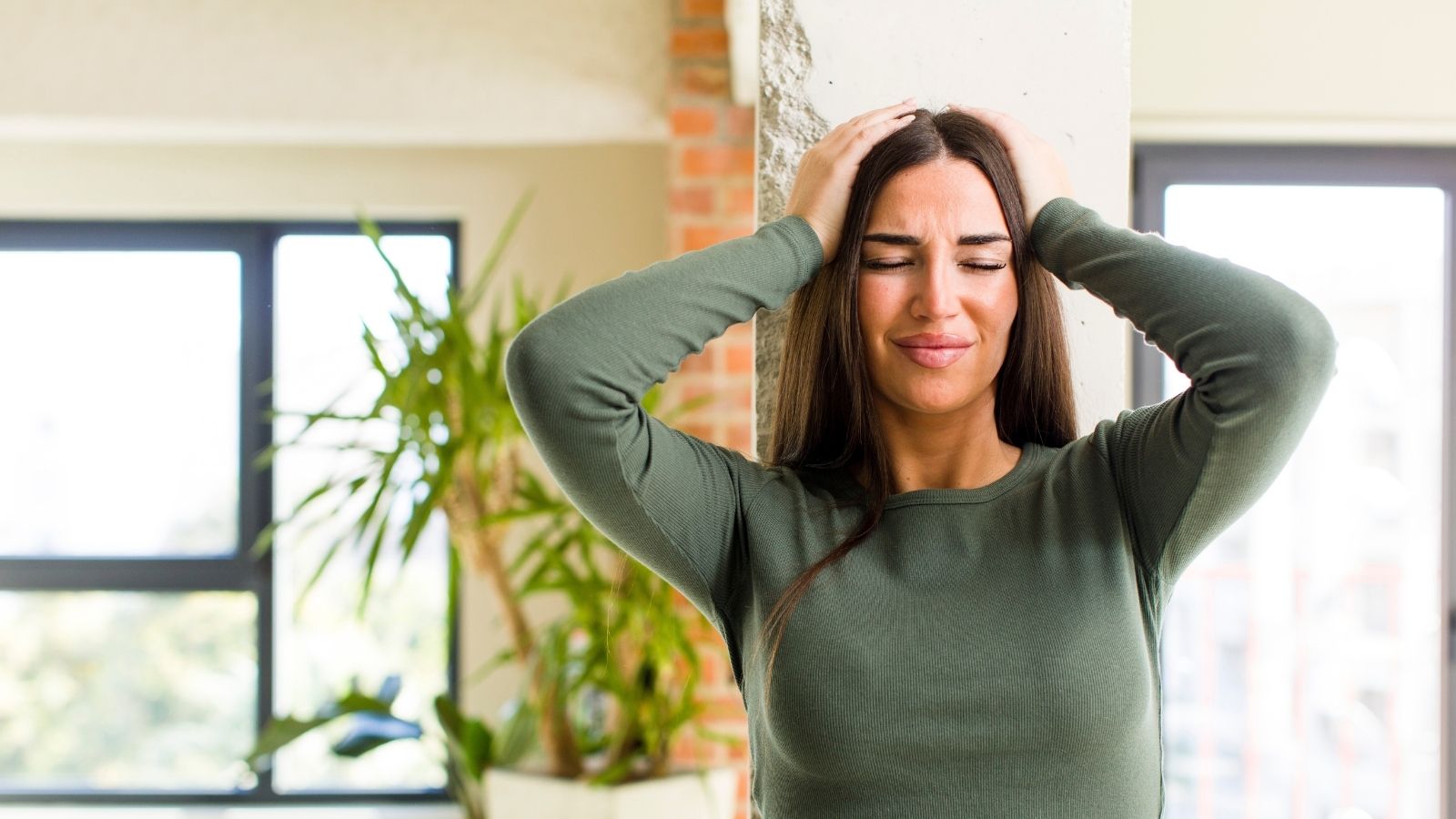 Woman Loved Her Peaceful Apartment Community—Then One New Neighbor Changed Everything stressed out woman with her hands on her head
