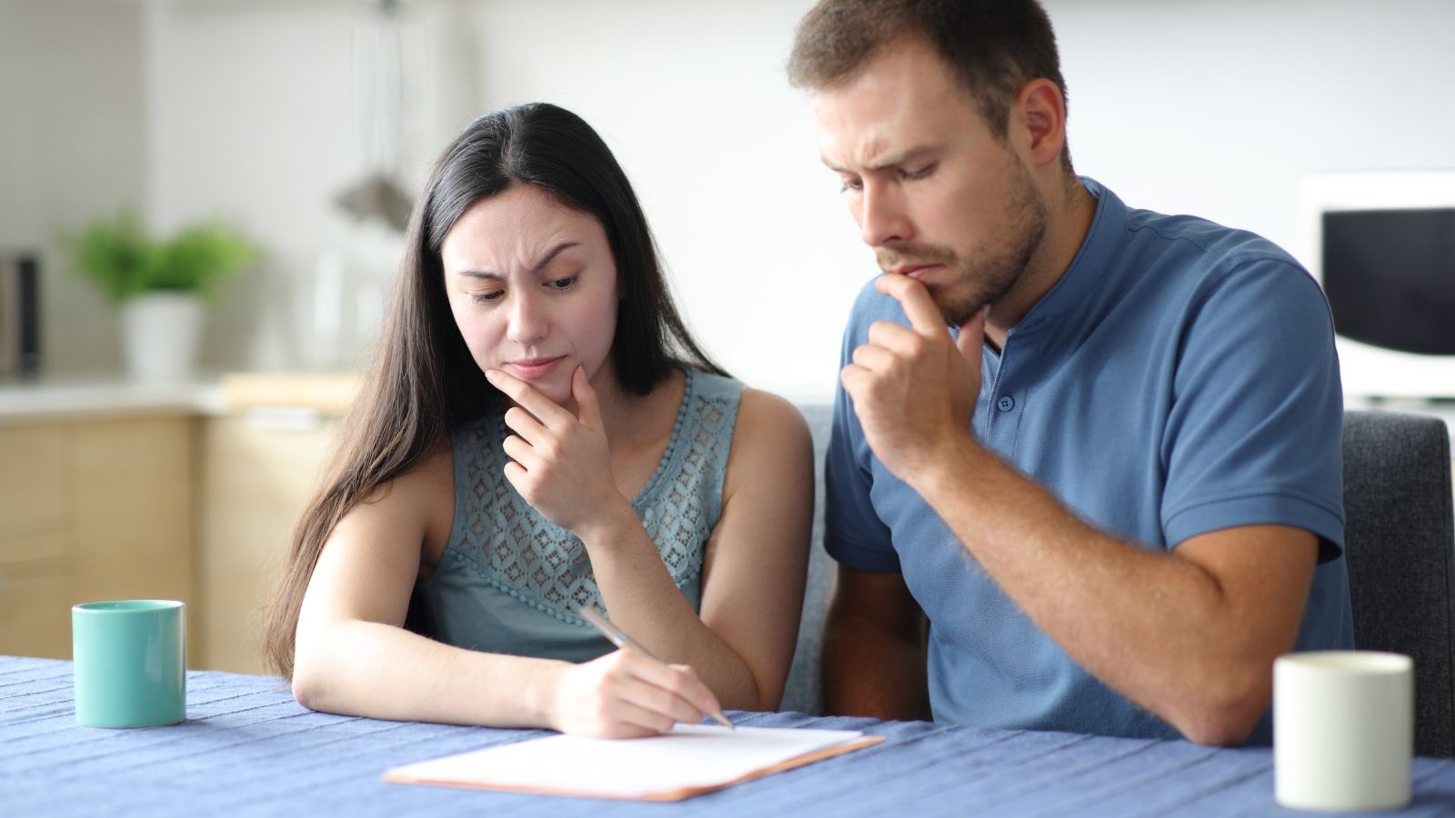 They Demanded Working Appliances Before Signing. Their Landlord Handed Them an Ultimatum Instead. couple trying to decide if they should sign something