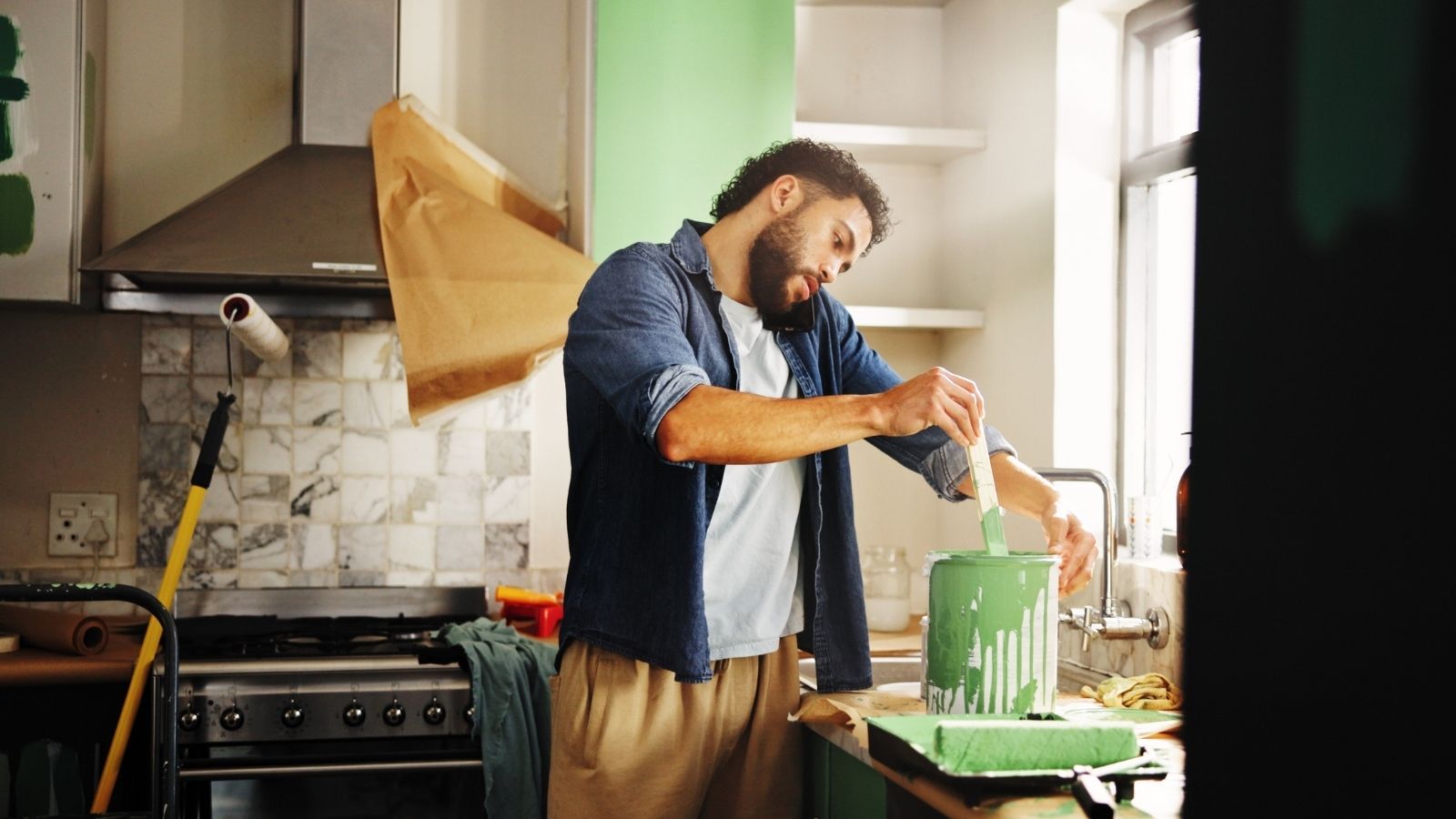 I Did the Work for FREE: Man Left $1,000 Out of Pocket After In Laws Refuse to Pay for Renovation Materials man working on a home renovation project