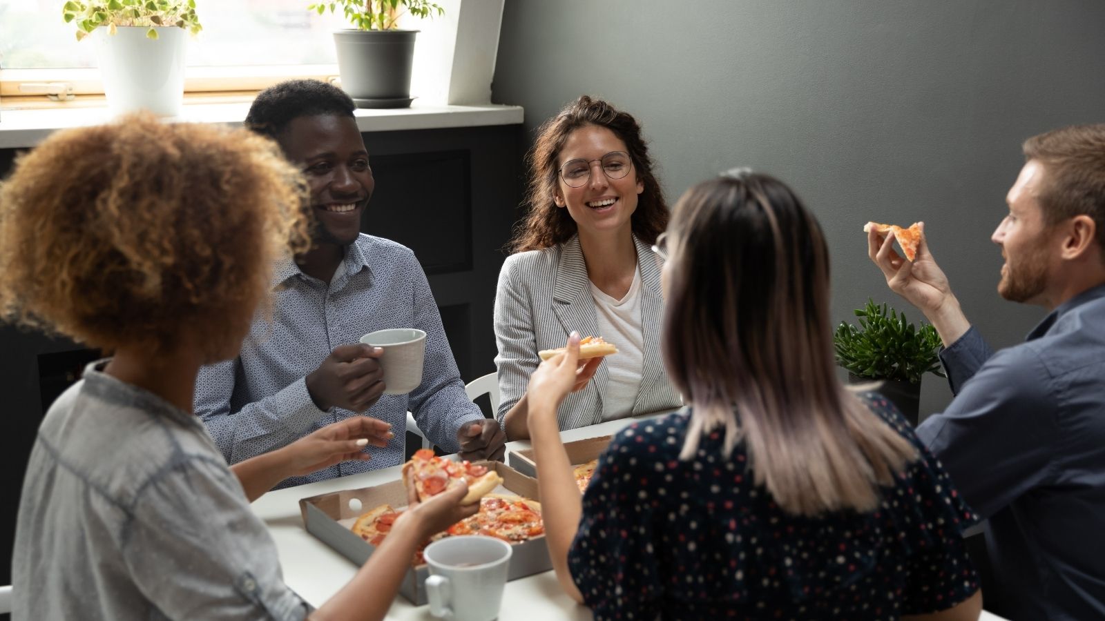 Employees Were Banned From Working Overtime—Then Management Wondered Why Work Stopped Getting Done coworkers eating pizza for lunch