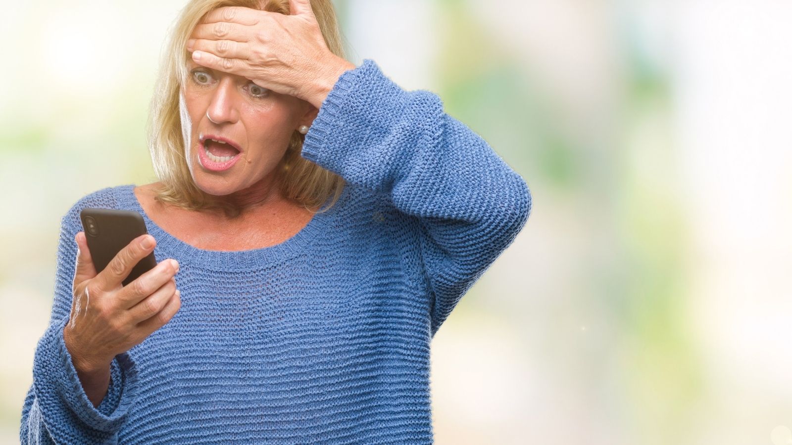 Why a Frustrated Lender Blew Up a Lifelong Friendship Online Over a Silent Bank Account shocked middle aged woman looking at her phone