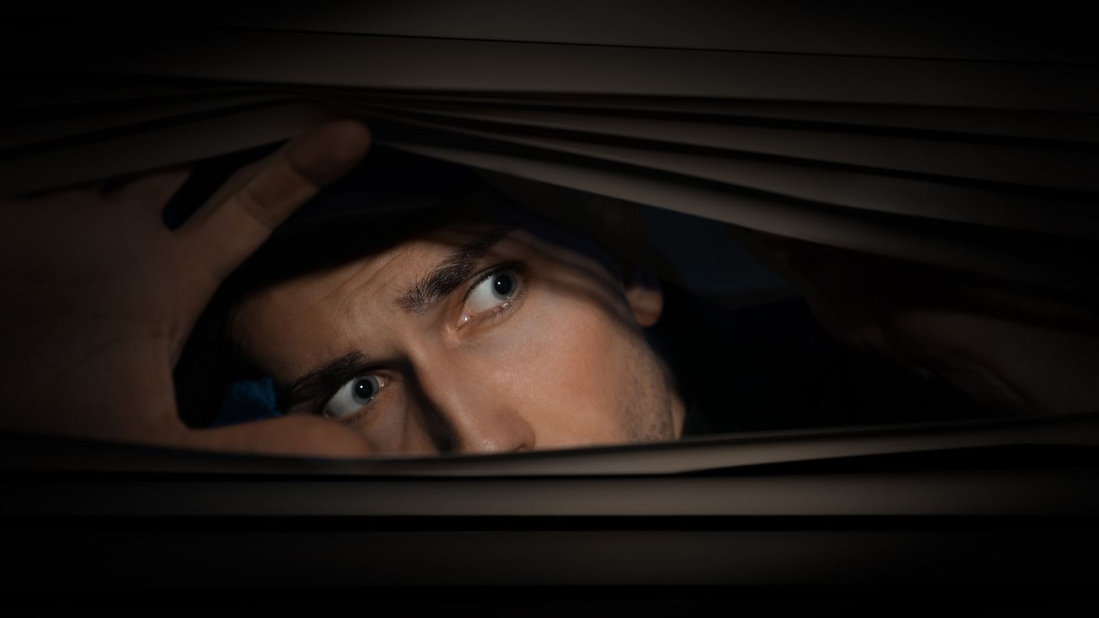 Why a Fed Up Homeowner Bypassed the Police to Launch an Immediate Parental Confrontation worried man looking out window at night