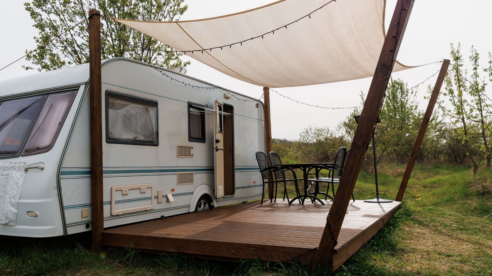 camper trailer with a wooden deck