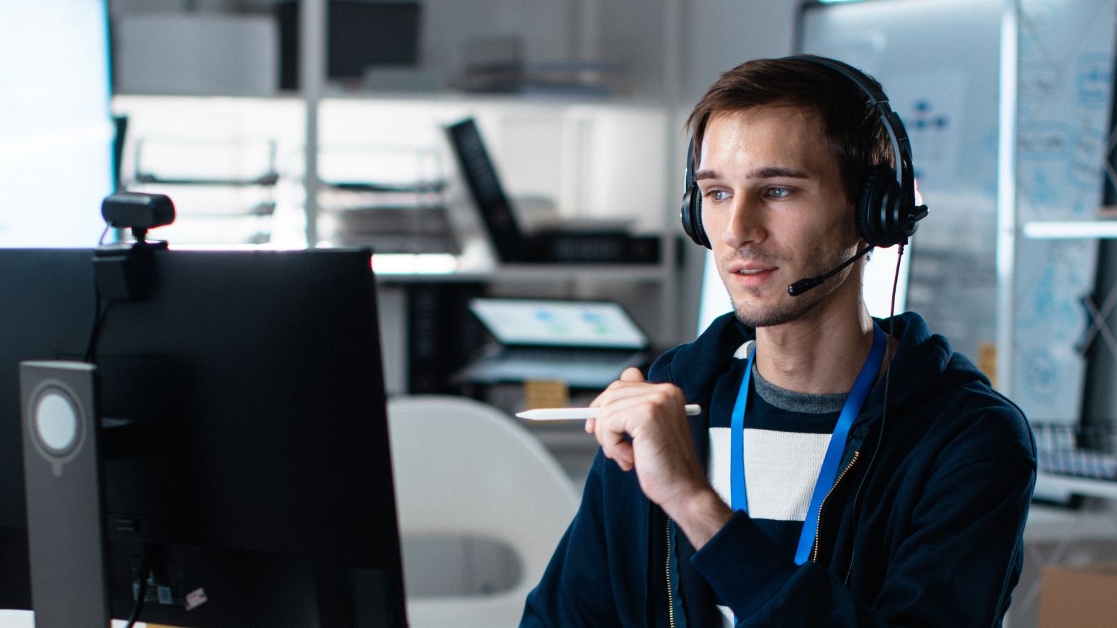 A Frustrated IT Specialist Is Reeling Over a Security Mandate Banning Contractors From Basic Systems man working in a call center